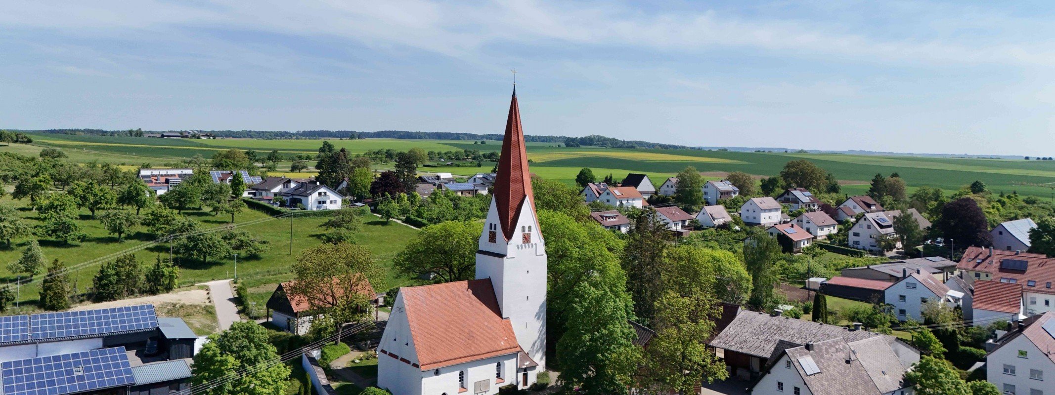 Haus verkaufen in Langenau: Ortsteil Hörvelsingen mit Kirche von oben